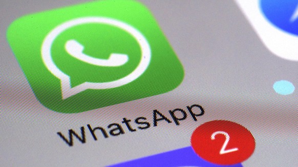 FILE - This March 10, 2017 file photo shows the WhatsApp communications app on a smartphone, in New York. The messaging app WhatsApp has sued the Indian government seeking to defend its users&#039; pr ...