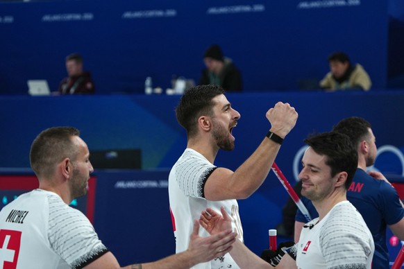 Switzerland's Pablo Lachat-Couchepin, Sven Michel, and Benoit Schwarz-van Berkel react after the men's curling round robin session against Britain, at the 2026 Winter Olympics, in Cortina d& ...