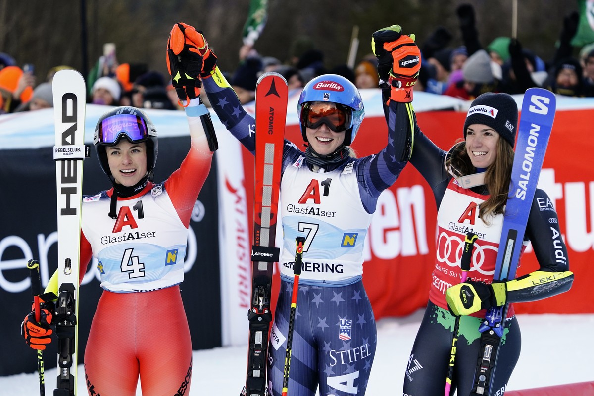United States' Mikaela Shiffrin, center, winner of an alpine ski, women's World Cup giant slalom, celebrates with second-placed Switzerland's Lara Gut Behrami, left, and third-placed It ...