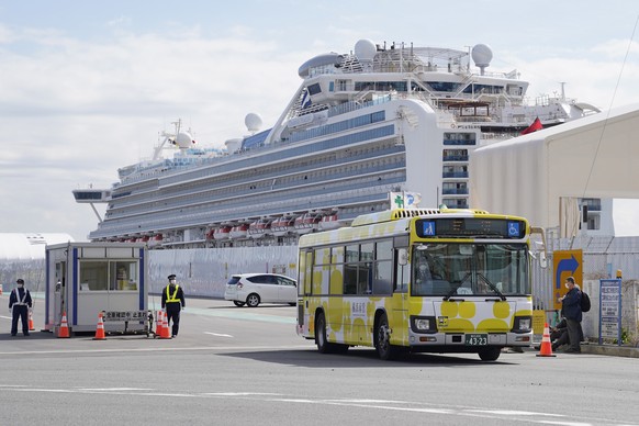 epa08229535 (FILE) - A bus carrying passengers of the Diamond Princess cruise ship, leaves the Daikoku Pier Cruise Terminal in Yokohama, Japan, 19 February 2020. (reissued 20 February 2020). According ...