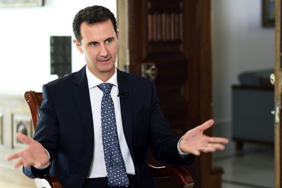 epa05189573 A handout picture made available on 01 March 2016 by the Syrian Arab news agency SANA shows Syrian President Bashar al-Assad speaks during an interview given to ARD German television in Da ...