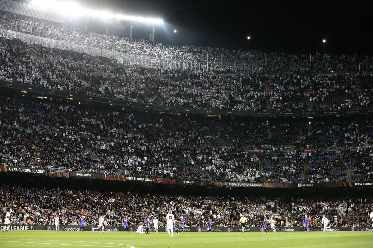 Eintracht Frankfurt cheer during the Europa League, second leg, quarterfinal soccer match between Barcelona and Eintracht Frankfurt at the Camp Nou stadium, in Barcelona, Spain, Thursday, April 14, 20 ...
