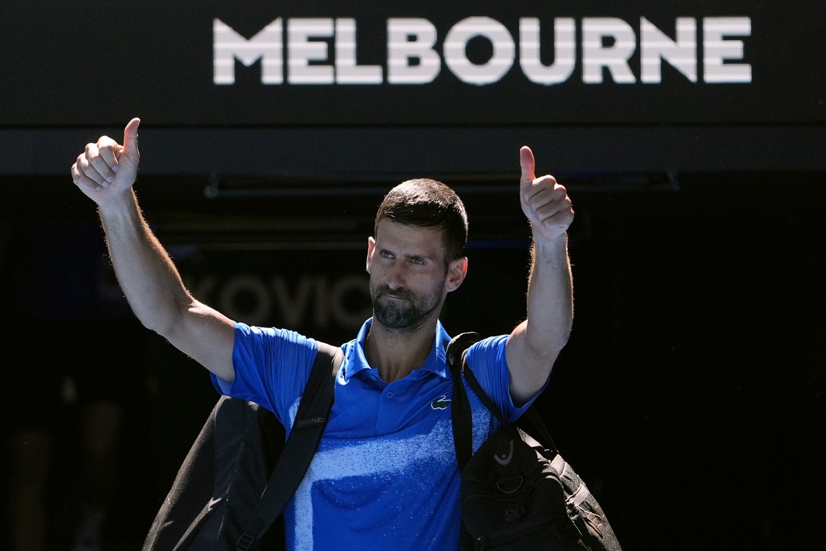 Novak Djokovic of Serbia gestures as he leaves Rod Laver Arena after retiring in his semifinal match against against Alexander Zverev of Germany at the Australian Open tennis championship in Melbourne ...