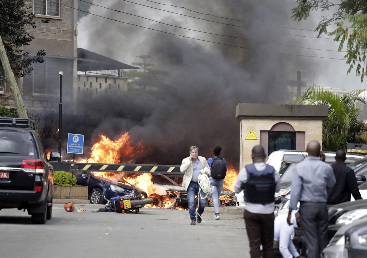 Fire and smoke rise from the scene of an explosion in Nairobi, Kenya Tuesday, Jan. 15, 2019.An upscale hotel complex in Kenya's capital came under attack on Tuesday, with a blast and heavy gunfir ...