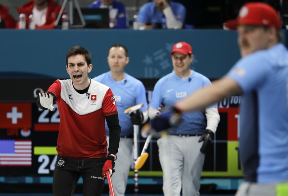 Switzerland&#039;s skip Peter de Cruz, left, makes a call during a men&#039;s curling match against United States at the 2018 Winter Olympics in Gangneung, South Korea, Tuesday, Feb. 20, 2018. (AP Pho ...