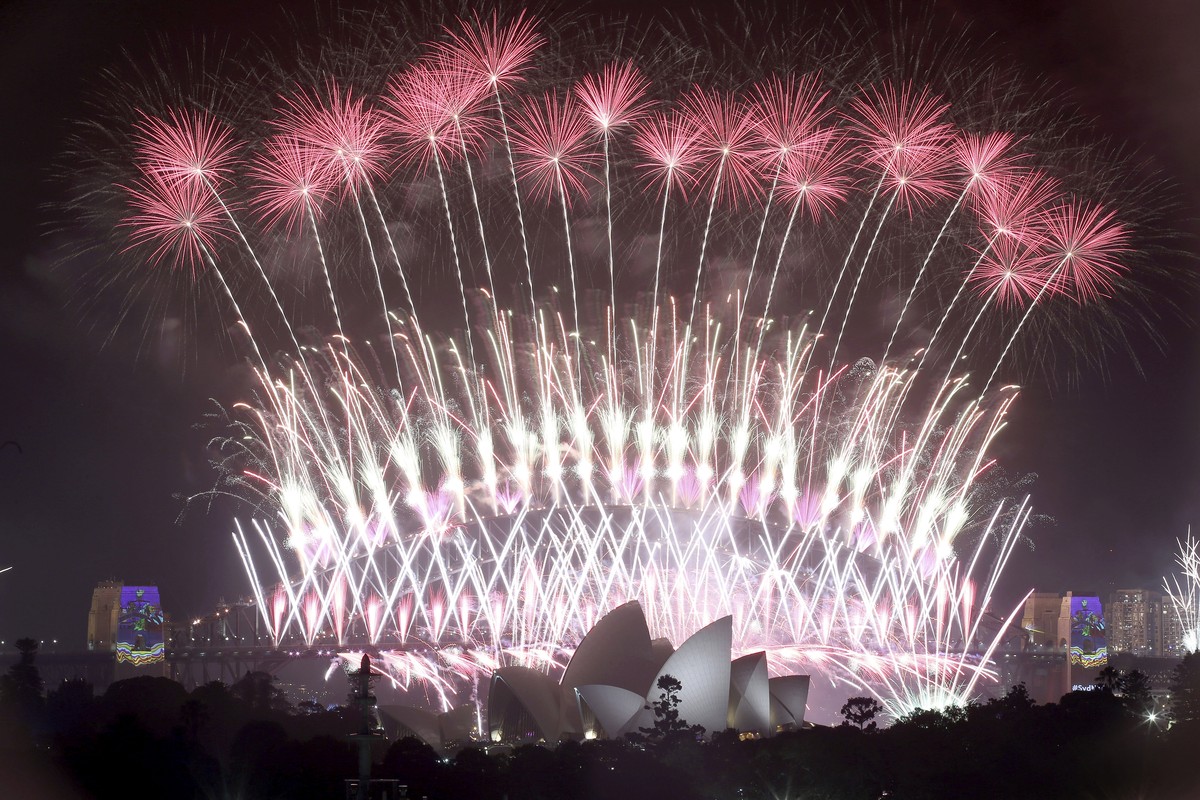 FILE - In this Jan. 1, 2017, file photo, fireworks explode over the Sydney Opera House and Harbour Bridge as New Year's celebrations are underway in Sydney. Australia's Prime Minister Scott  ...