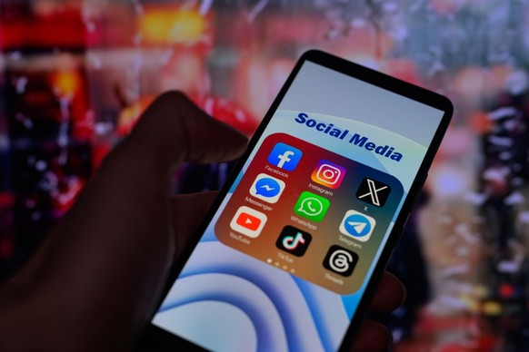 Icons for various social media apps, including Facebook, Instagram, X, Threads, and TikTok, are being displayed on a smartphone in this photo illustration taken in Brussels, Belgium, on January 22, 20 ...