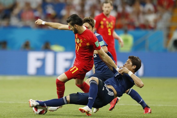 Belgium&#039;s Yannick Carrasco battles for the ball with Japan&#039;s Hiroki Sakai, bottom, during their round of 16 match at the 2018 soccer World Cup in the Rostov Arena, in Rostov-on-Don, Russia,  ...