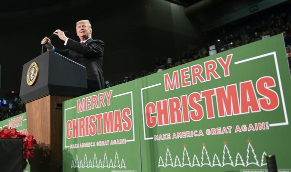 President Donald Trump takes to the stage at a campaign-style rally at the Pensacola Bay Center, in Pensacola, Fla., Friday, Dec. 8, 2017. (AP Photo/Susan Walsh)