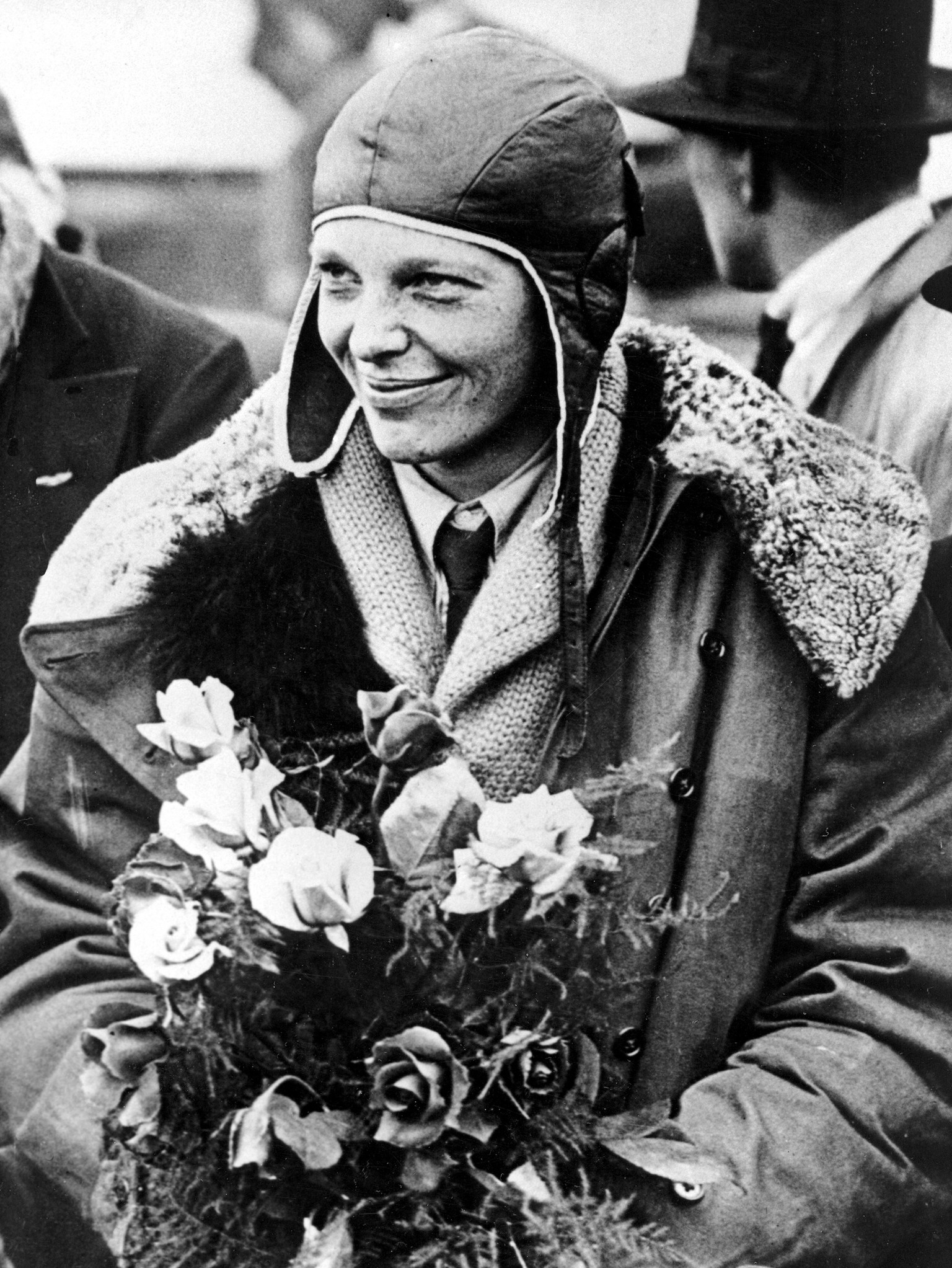 FILE - In a June 26, 1928 file photo, American aviatrix Amelia Earhart poses with flowers as she arrives in Southampton, England, after her transatlantic flight on the &quot;Friendship&quot; from Burr ...