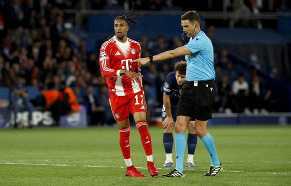 epa12920137 Referee Sandro Schaerer points to the spot to award Bayern a penalty during the UEFA Champions League semi-final match between Paris Saint-Germain and Bayern Munich in Paris, France 28 Apr ...