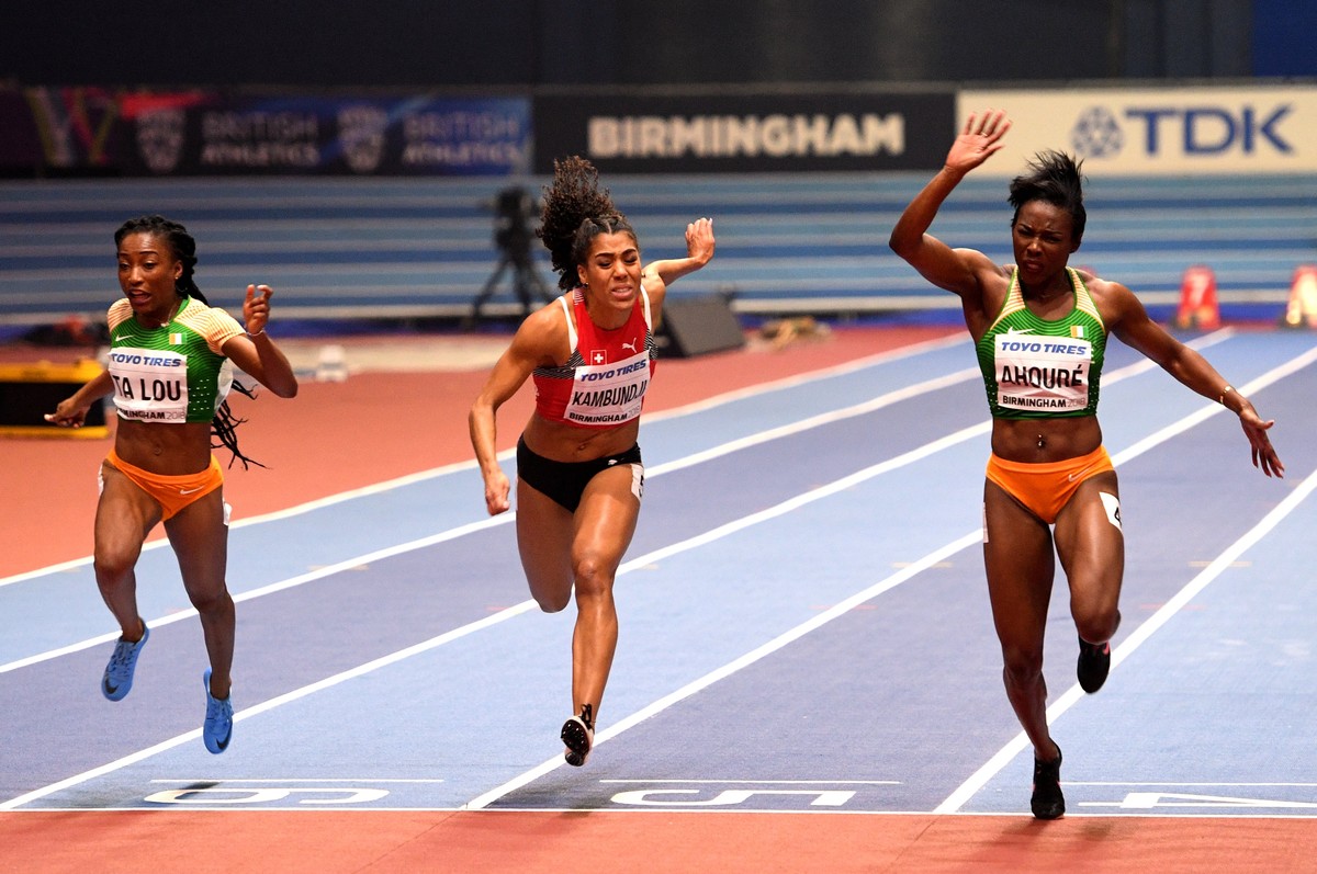 epa06575956 Murielle Ahoure from the Ivory Coast wins the Women's 60m final ahead of compatriot Marie-Josee Ta Lou and Mujinga Kambundji of Switzerland during the IAAF Athletics World Indoor Cham ...
