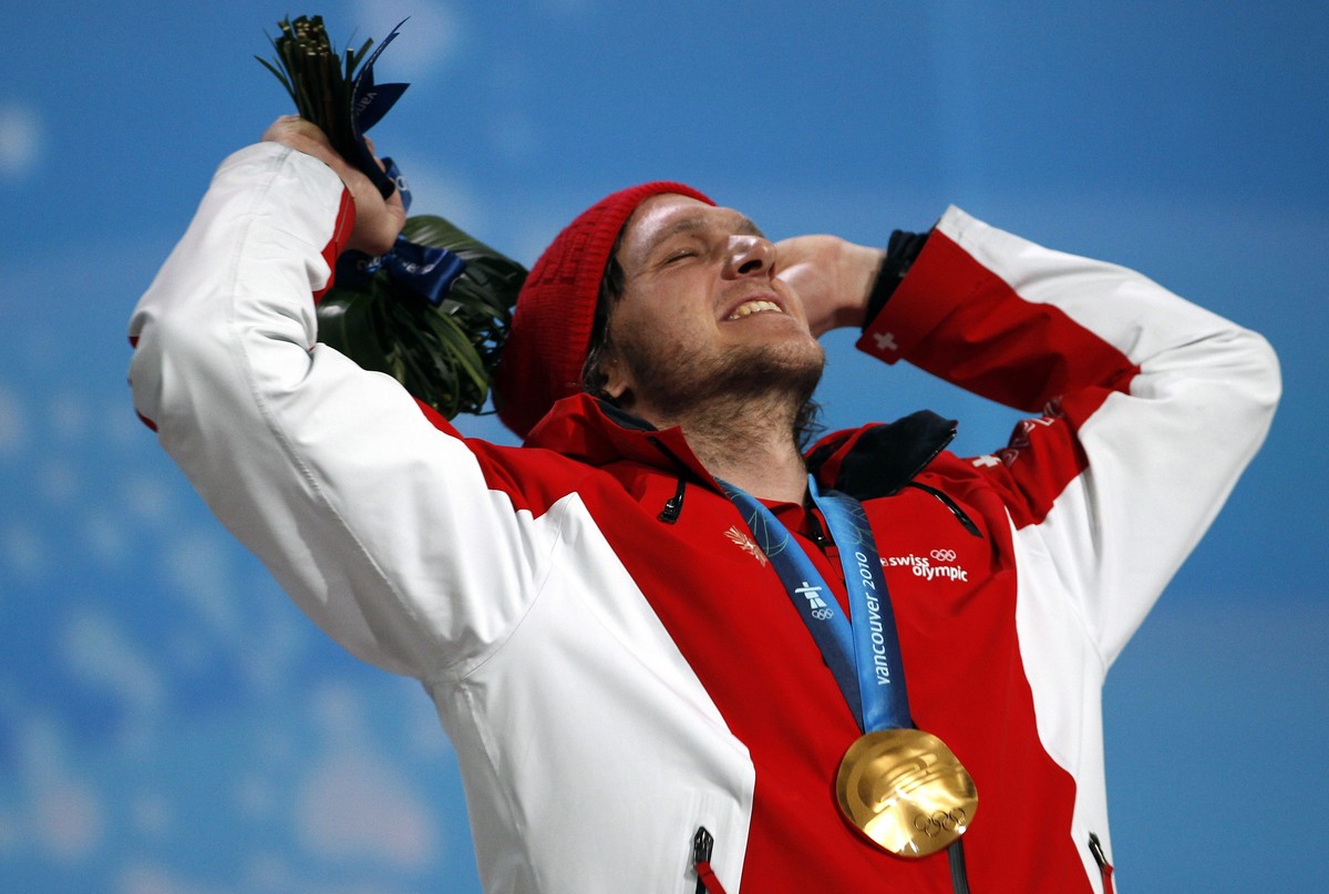 epa02046947 Freestyle skiing's Ski Cross Men's gold medal winner, Michael Schmidt of Switzerland, celebrates during the medal ceremony at the BC center for the Vancouver 2010 Olympic Games,  ...