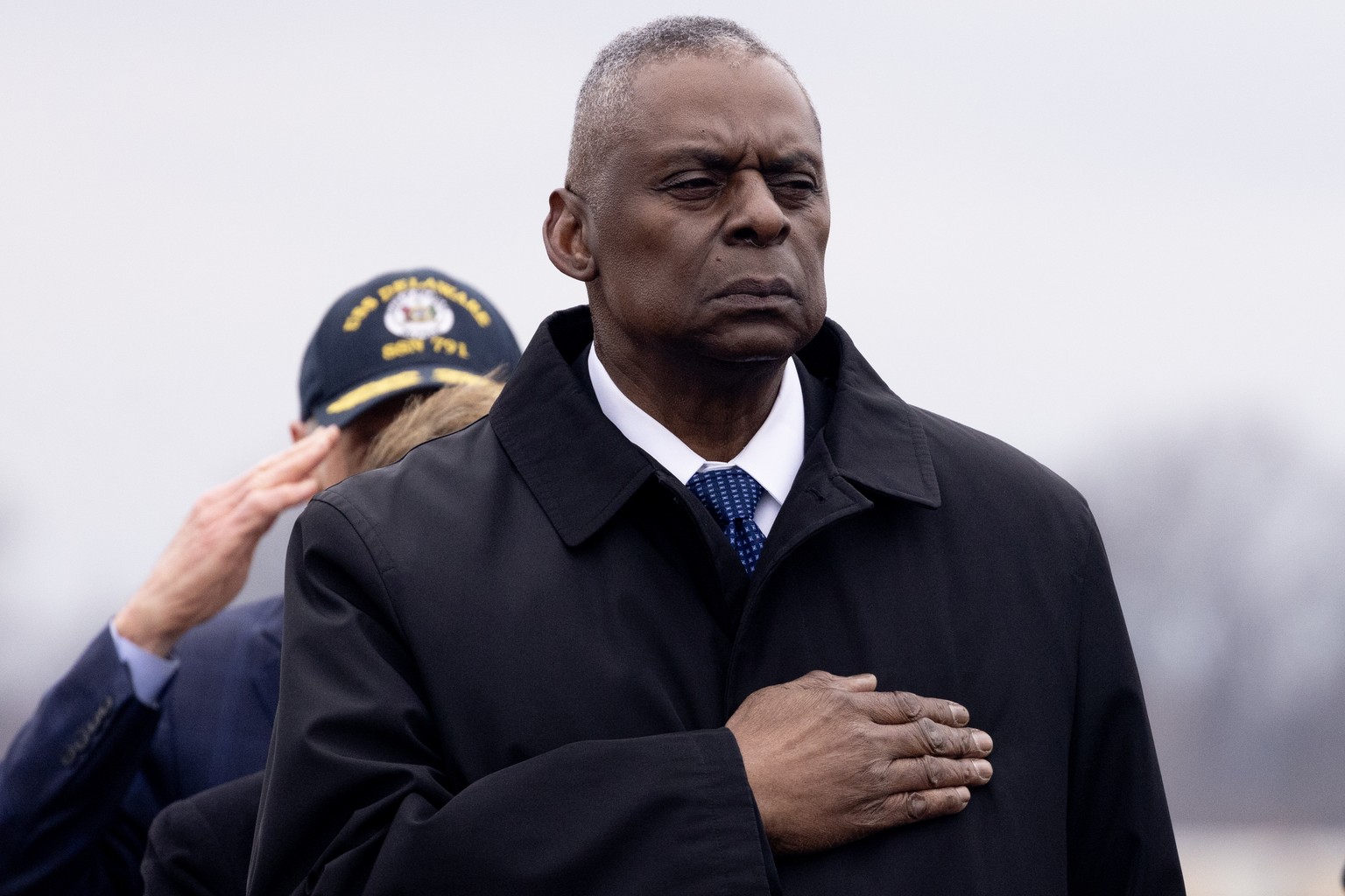 epa11121831 US Secretary of Defense Lloyd Austin watches a US Army carry team move a flag-draped transfer case containing the remains of a fallen US service member during a dignified transfer at Dover ...