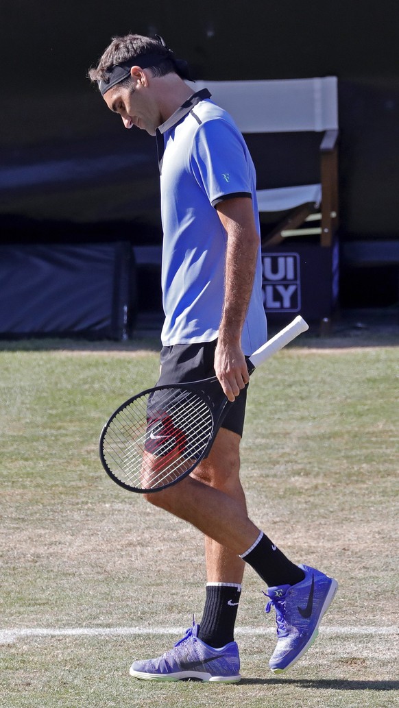 epa06028304 Roger Federer of Switzerland reacts after losing his second round match against Tommy Haas of Germany at the ATP Mercedes Cup tennis tournament in Stuttgart, Germany, 14 June 2017. EPA/RON ...