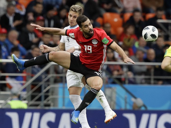 Uruguay&#039;s Guillermo Varela, background, and Egypt&#039;s Abdalla Said challenge for the ball during the group A match between Egypt and Uruguay at the 2018 soccer World Cup in the Yekaterinburg A ...