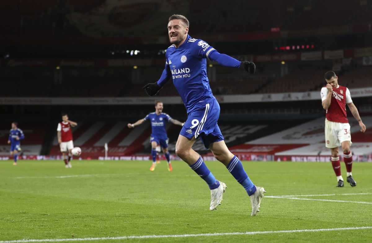 Leicester's Jamie Vardy celebrates after scoring his team's first goal during the English Premier League soccer match between Arsenal and Leicester City at Emirates Stadium in London, Englan ...