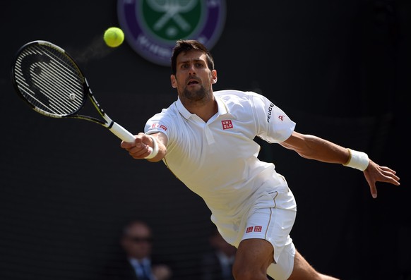 epa05403372 Novak Djokovic of Serbia returns to Sam Querrey of the US in their third round match during the Wimbledon Championships at the All England Lawn Tennis Club, in London, Britain, 02 July 201 ...