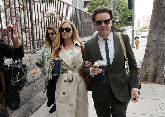 FILE - Danny Masterson, right, and his wife Bijou Phillips arrive for closing arguments in his second trial, May 16, 2023, in Los Angeles. A jury found ?That ?70s Show? star Masterson guilty of two co ...