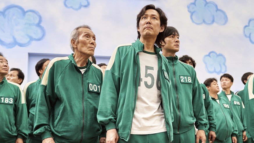 This image released by Netflix shows Lee Jung-jae, center, Park Hae-soo, right, and Oh Yeong-soo in a scene from the Korean series &quot;Squid Game.&quot; Both Park Hae-Soo and Oh Yeong-Su were nomina ...