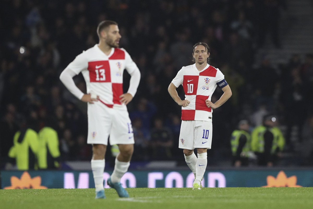 Croatia's Luka Modric, right, and Croatia's Nikola Vlasic react after Scotland's John McGinn scoring the opening goal during the UEFA Nations League soccer match between Scotland and Cr ...