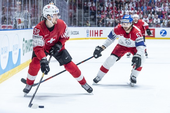 Switzerland&#039;s Gaetan Haas , left, against Czechy`s Michael Frolik during the game between Czech Republic and Switzerland, at the IIHF 2019 World Ice Hockey Championships, at the Ondrej Nepela Are ...