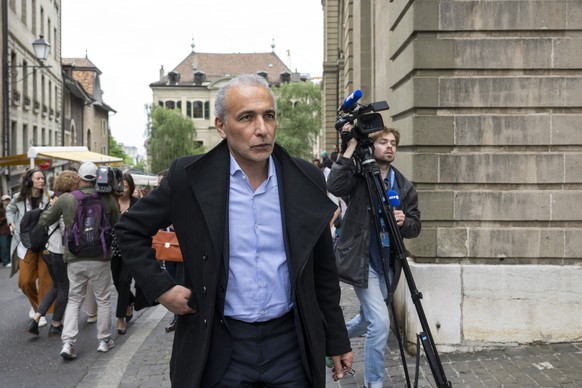 epa10649787 Swiss leading Islamic scholar Tariq Ramadan leaves the Geneva courthouse after hearing his verdict on a sexual assault investigation, in Geneva, Switzerland, 24 May 2023. EPA/MARTIAL TREZZ ...