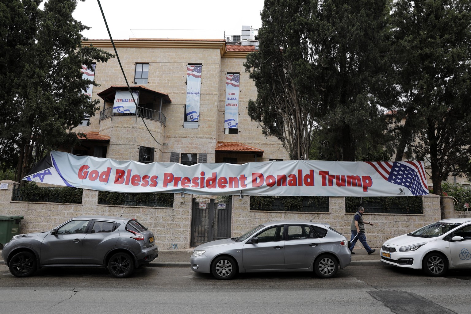 epa06732618 A sign hang on a house near the US consulate that will act as the new US embassy in the Jewish neighborhood of Arnona, on the East-West Jerusalem line in Jerusalem, Israel, 13 May 2018. Tr ...