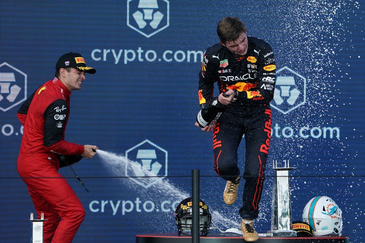 epa09934777 Monaco's Charles Leclerc of Scuderia Ferrari (L), Holland's Max Verstappen of Red Bull Racing (R) celebrate on the podium after the Formula One Grand Prix of Miami at the Miami I ...