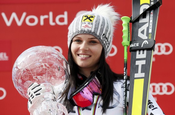 Anna Fenninger of Austria holds the Globe trophy on the podium after winning the women's giant slalom race at the Alpine Skiing World Cup Finals in Meribel, in the French Alps, March 22, 2015 REUTERS/Robert Pratta