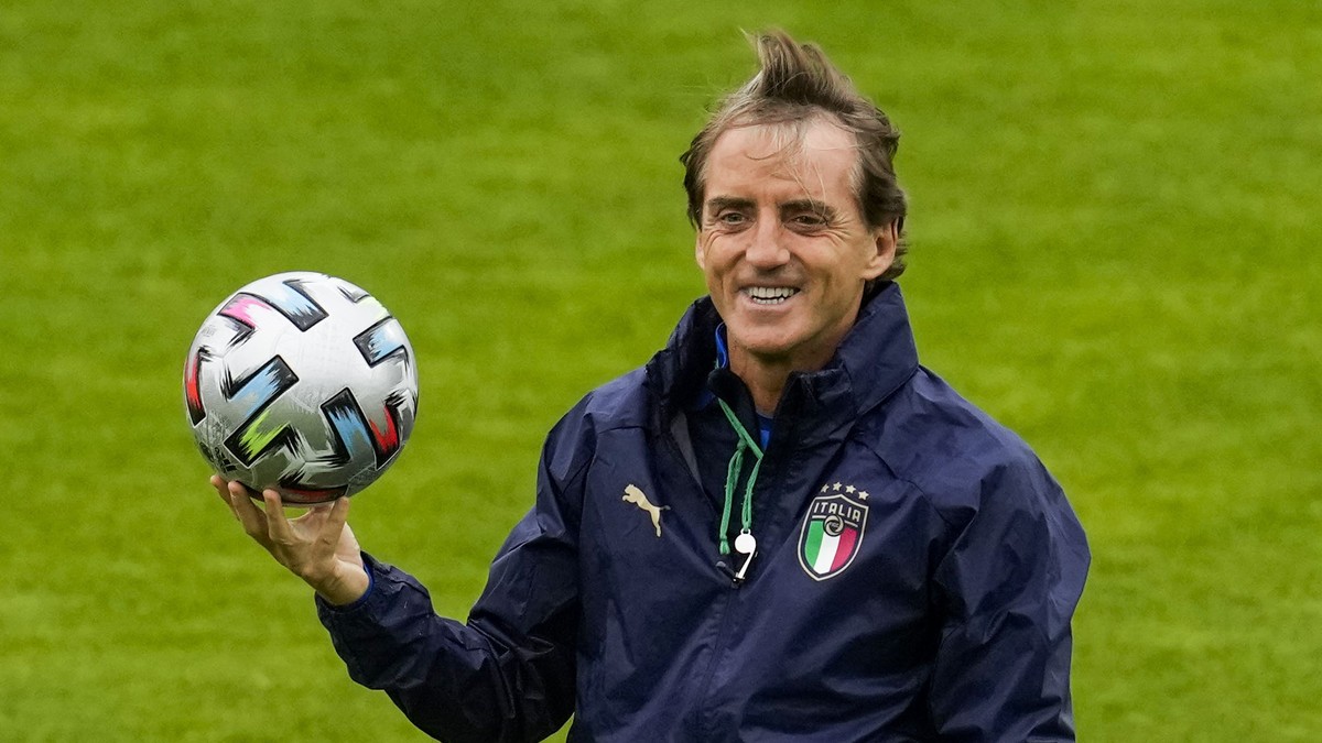FILE - Italy's manager Roberto Mancini smiles during a training session at the Hive stadium in London, England, on July 5, 2021. Italy coach Roberto Mancini resigned surprisingly on Sunday, Aug.  ...