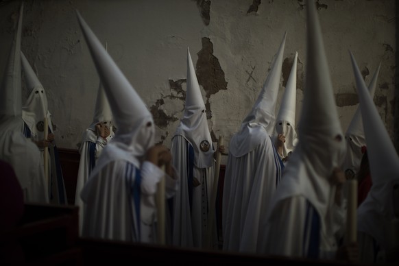 Hooded penitents from &quot;La Sed&quot; brotherhood take part in a procession in Jerez de la Frontera, Cadiz province in Andalucia, southern Spain, Monday, April 15, 2019. Hundreds of processions tak ...