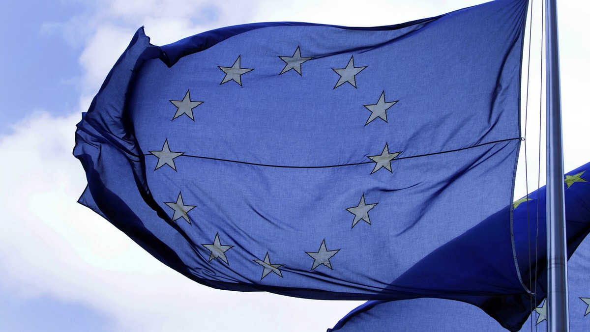 In this Tuesday May 4, 2010 file photo an EU flag blows in the wind outside a meeting of EU transport ministers at the EU Council building in Brussels. The European Union was awarded on Friday Oct. 12 ...