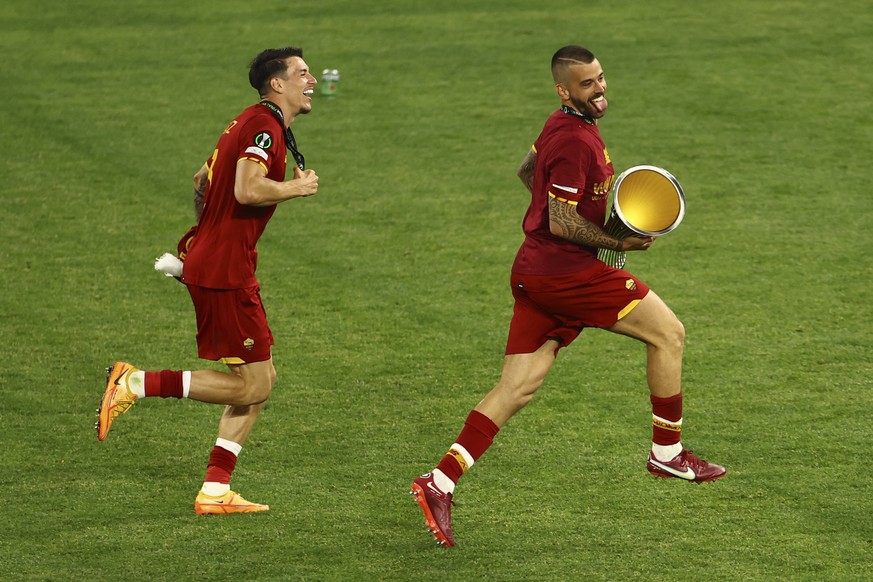 Roma players celebrate with the trophy after the Europa Conference League final soccer match between AS Roma and Feyenoord at the National Arena stadium in Tirana, Albania, Wednesday, May 25, 2022. Ro ...