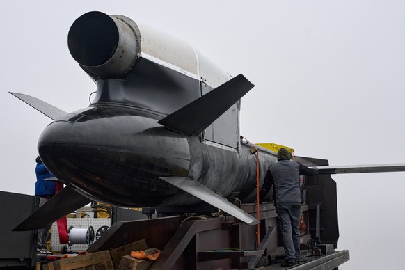 Workers and military inspect Ukrainian Fire Point's Flamingo missiles during handover to the military in an undisclosed location in Ukraine Thursday, Dec. 4, 2025. (AP Photo/Efrem Lukatsky)
Russi ...