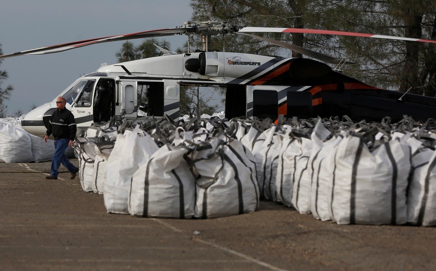 Rock is prepped to be used on the Lake Oroville Dam after an evacuation was ordered for communities downstream from the dam, in Oroville, California, U.S. February 13, 2017. REUTERS/Jim Urquhart