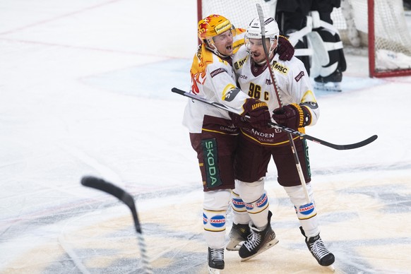 Geneva&#039;s player Noah Rod, right, celebrates the 1-2 goal with teammate Geneva&#039;s player Sakari Manninen, left, during the preliminary round game of National League Swiss Championship 2023/24  ...