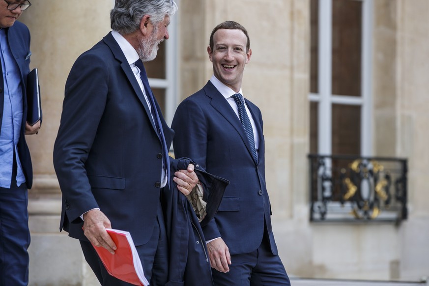 epa06757723 Facebook&#039;s CEO Mark Zuckerberg (R) and VivaTech founder Maurice Levy (C) leave the Elysee Palace after the Tech for Good summit, in Paris, France, 23 May 2018. Tech for Good summit is ...