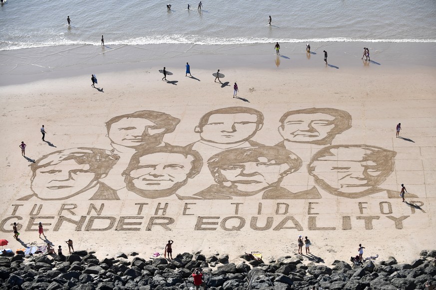 epa07788456 A sand art performance by French artist Sam Dougados representing G7 leaders (L-R, Boris Johnson, Justin Trudeau, Giuseppe Conte, Emmanuel Macron, Angela Merkel, Shinzo Abe and Donald Trum ...