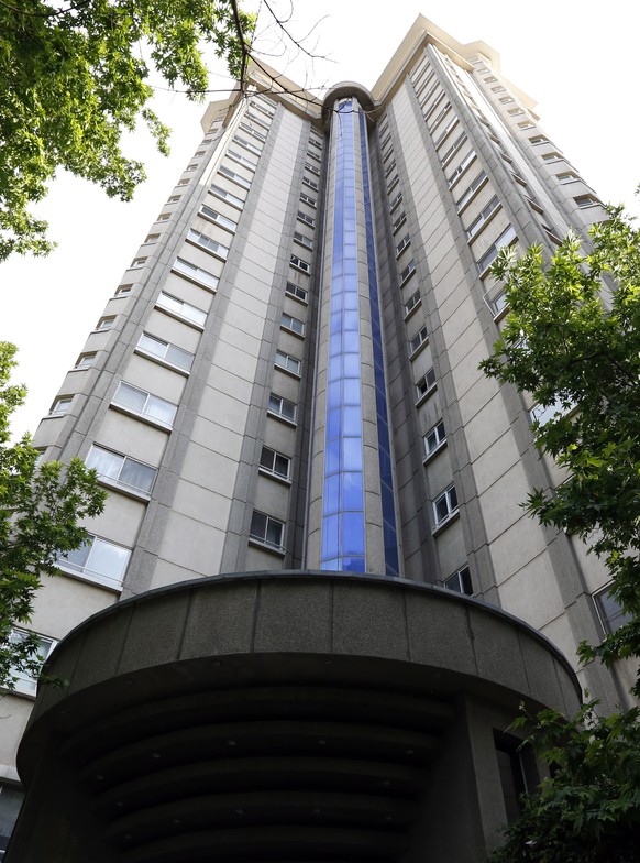 epa09177494 Exterior view of the high-riser where a Swiss embassy staff was resident, in the Kamranieh neighbourhood in Tehran, Iran, 04 May 2021. According to the emergency service spokesman, a senio ...