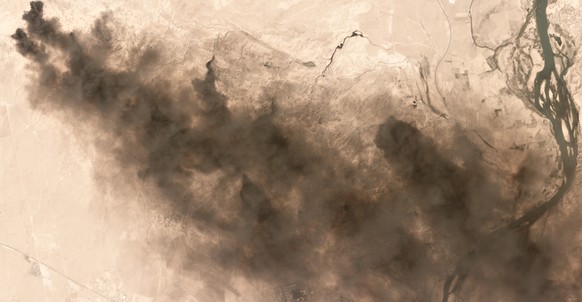 In this image provided by AllSource Analysis, taken Sept. 4, 2016, burning oil fields are seen near Qayyarah, Iraq. A fire at one of Iraq’s major oil fields could hinder military and humanitarian effo ...