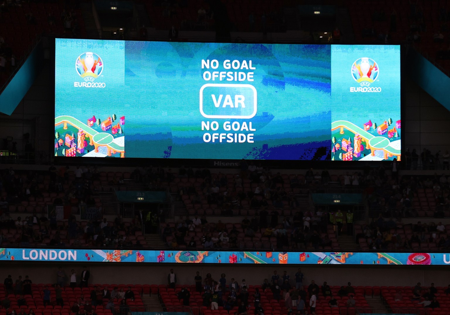 epa09304321 VAR decision on the screen after Marko Arnautovic of Austria scored from an offside position during the UEFA EURO 2020 round of 16 soccer match between Italy and Austria in London, Britain ...