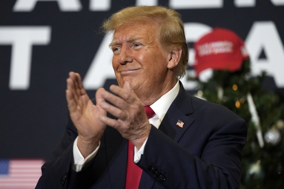FILE - Former President Donald Trump reacts to supporters during a commit to caucus rally, Tuesday, Dec. 19, 2023, in Waterloo, Iowa. An appeals court said Tuesday, Jan. 2, 2024, that Michael Cohen ca ...