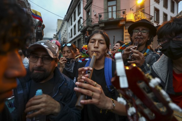 epa10019413 Demonstrators play folk music during a protest against the Government of Guillermo Lasso, in Quito, Ecuador, 17 June 2022. A large march of students, unions, and peasants once again marche ...