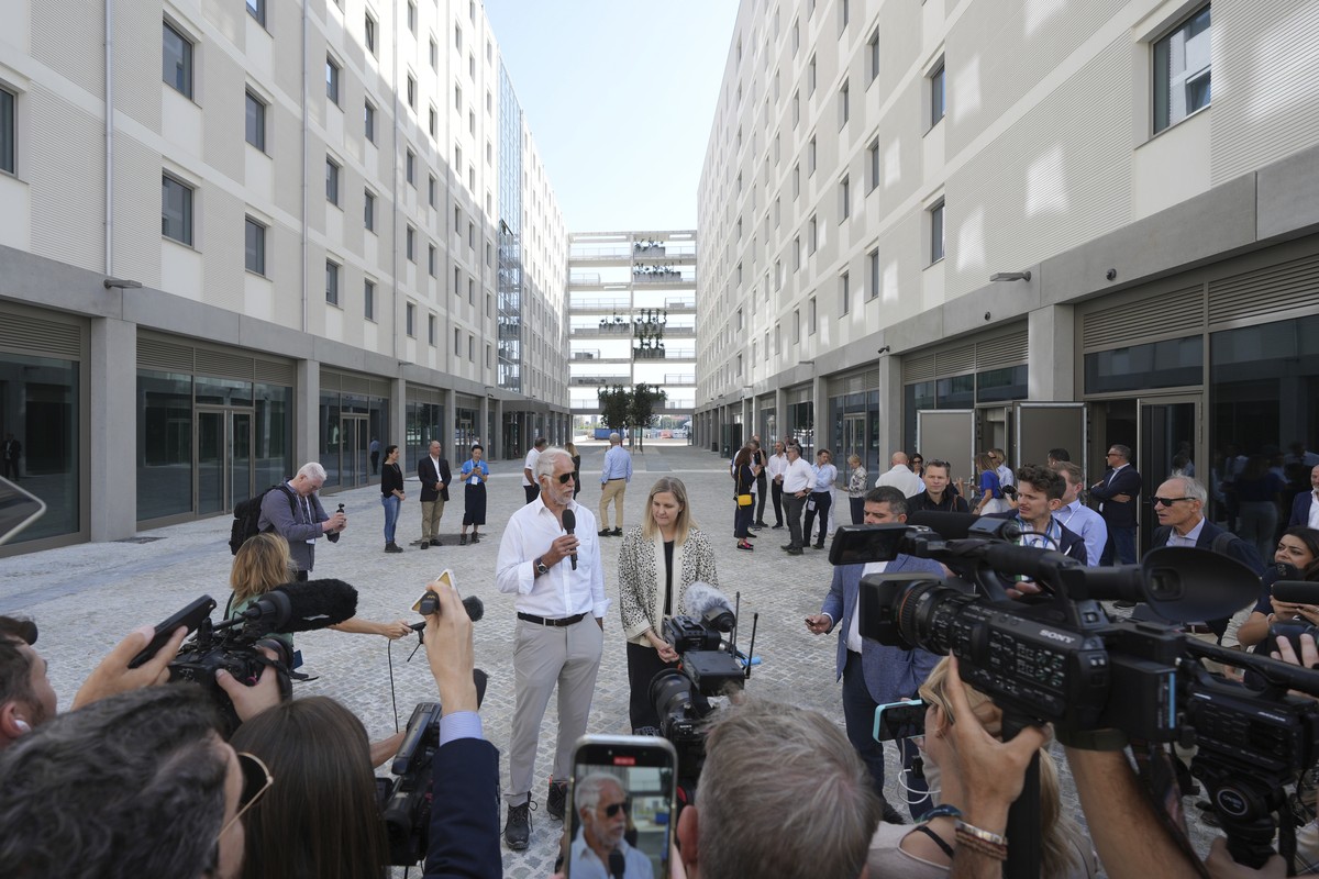 IOC President Kirsty Coventry, right, and Milano Cortina 2026 Foundation President Giovanni Malagò speak to the media during a visit to the Olympic and Paralympic Village in Milan, Italy, Thursday, Se ...