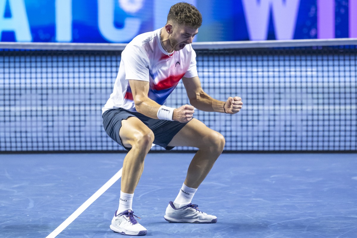 Switzerland's Jerome Kym cheers after winning his round of sixteen match against USA's Ben Shelton at the Swiss Indoors tennis tournament at the St. Jakobshalle in Basel, Switzerland, on Thu ...