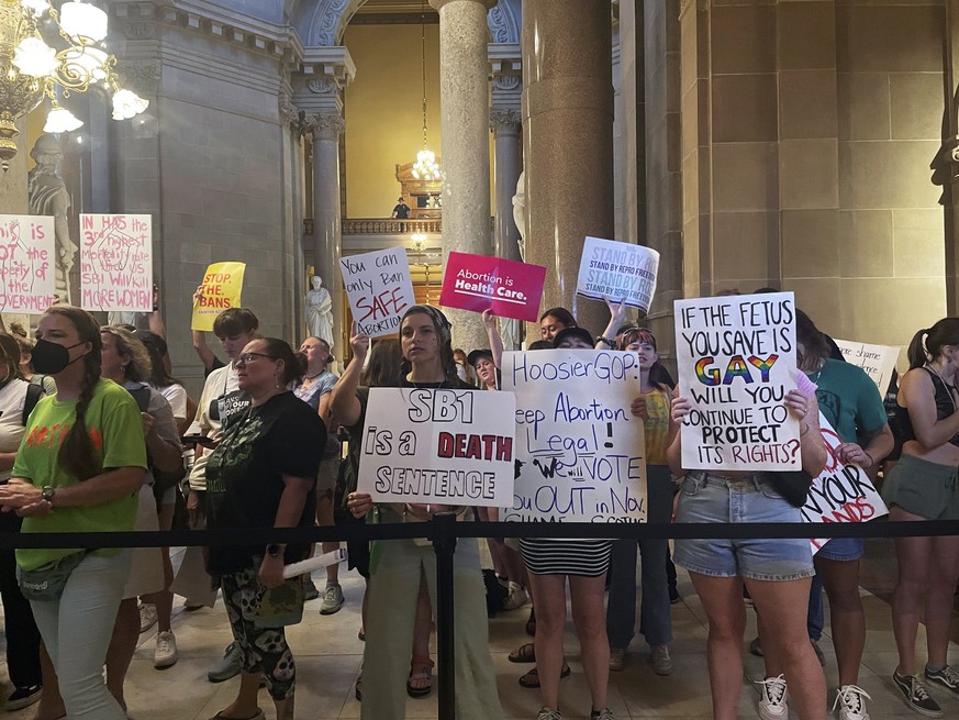 Abortion-rights protesters fill Indiana Statehouse corridors and cheer outside legislative chambers, Friday, Aug. 5, 2022, as lawmakers vote to concur on a near-total abortion ban, in Indianapolis. (A ...