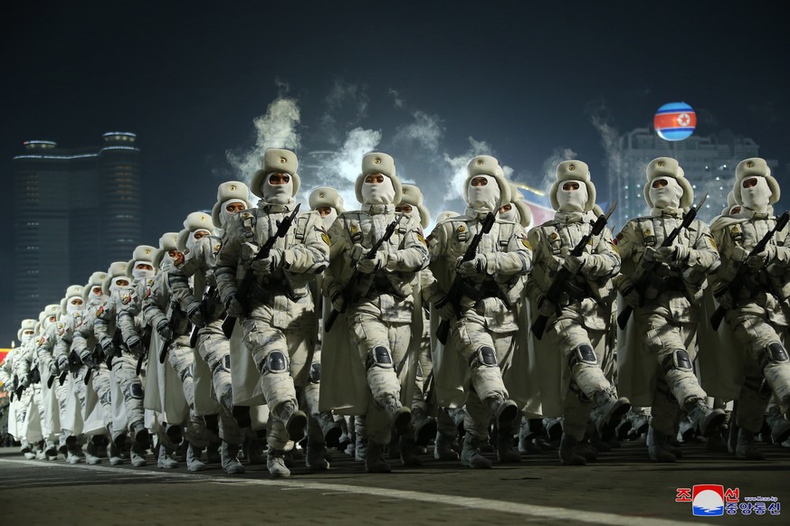 epa10455980 A photo released by the official North Korean Central News Agency (KCNA) shows North Korean soldiers march during a military parade at Kim Il Sung Square to mark the 75th anniversary of th ...