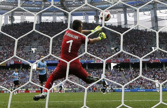 epa06868583 Goalkeeper Fernando Muslera of Uruguay can not stop the ball as France go 2-0 up during the FIFA World Cup 2018 quarter final soccer match between Uruguay and France in Nizhny Novgorod, Ru ...