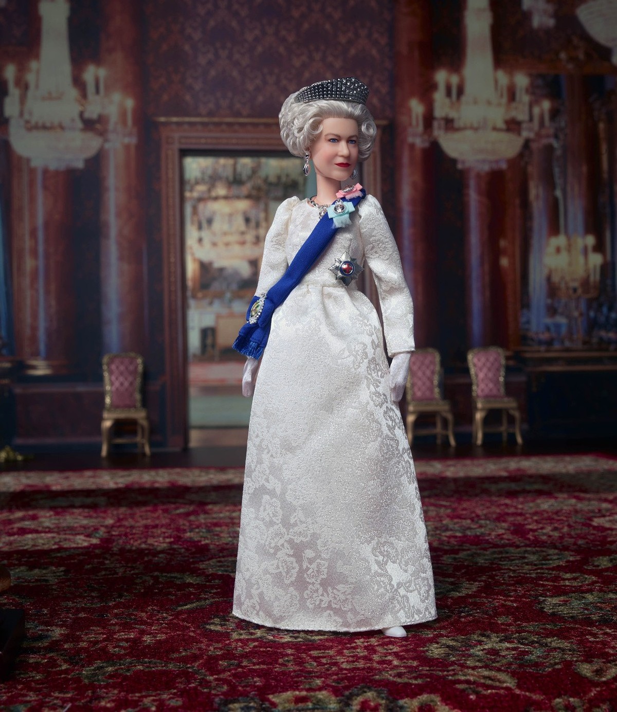 This undated photo provided by Mattel shows Mattel's new Queen Elizabeth II Barbie doll. Britain's Queen Elizabeth II was marking her 96th birthday privately Thursday, April 21, 2022, retrea ...